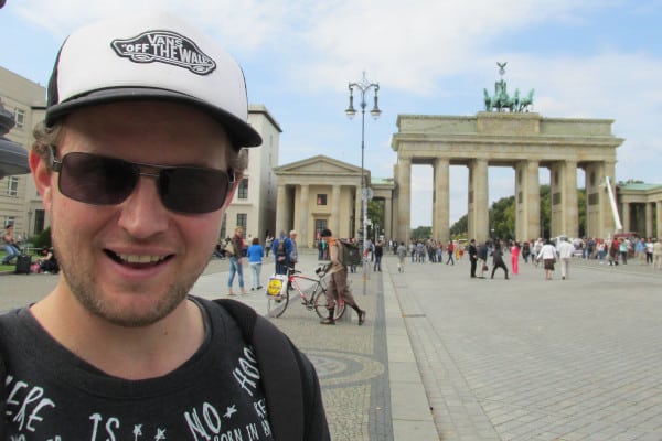 John standing before the Brandenburg Gate
